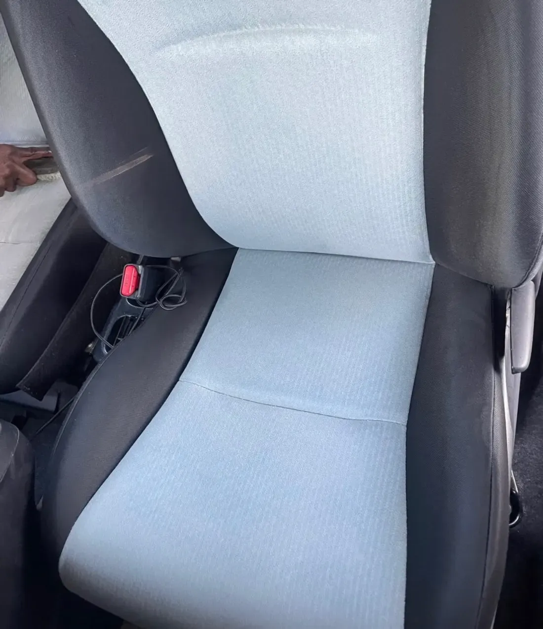 A cleaned two-tone car seat after fabric extraction cleaning by CDCS